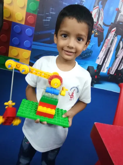 This student created a simple machine, a crane, using basic engineering kits to learn about levers and pulleys.