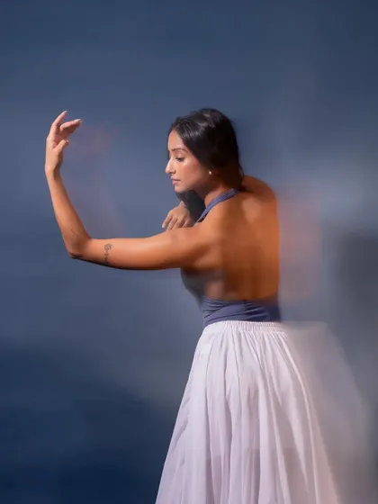 A motion-blur photograph that captures the fluidity and grace of dance, making the movement visible in a still image.