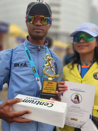 A podium finish at the Super Sikh Run. Our runner holding his trophy, a symbol of his hard work and our effective training methods.