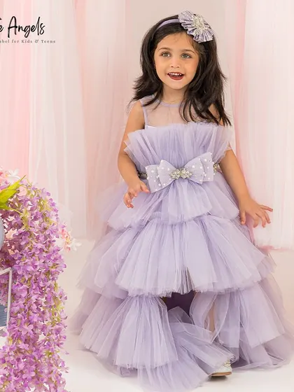 A full front view of the tiered lilac gown, a fun and fashionable choice for any party.