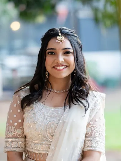 A happy and radiant bride-to-be. The soft glam makeup is perfect for a Sangeet, creating a look that is both festive and elegant.