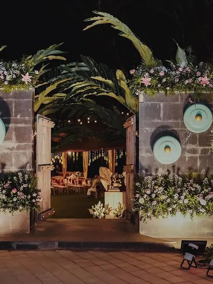 The grand entrance to Bhumi and Avi's wedding reception. We designed a stunning floral-adorned gateway to welcome guests into an evening of elegance and celebration.