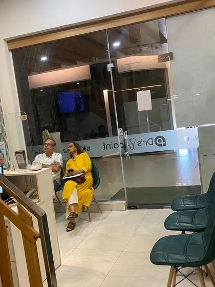 Clients waiting in our comfortable reception area. We strive to create a welcoming atmosphere for everyone seeking aesthetic solutions.
