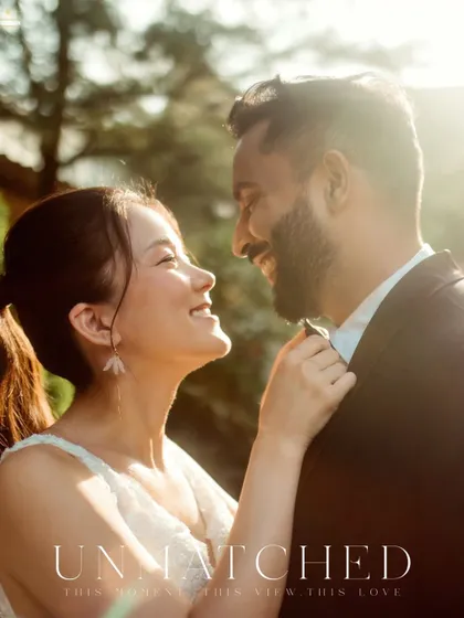 A beautiful, candid moment of her adjusting his tie. It’s these small, natural gestures of affection that I love to capture, as they speak volumes about a couple's relationship. The warm backlighting adds a romantic feel to this pre-wedding photo.