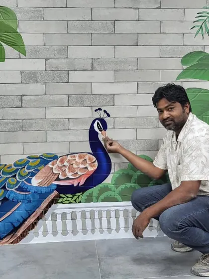 My talented team member giving the peacock in the Providence mural its final, delicate touches.