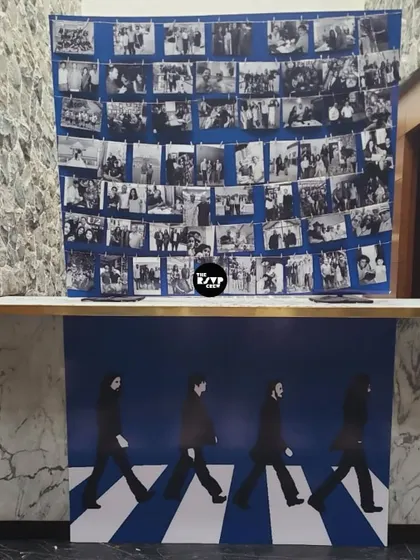 A Beatles-themed photo wall for a 60th birthday, with the iconic Abbey Road silhouette and a collage of memories.