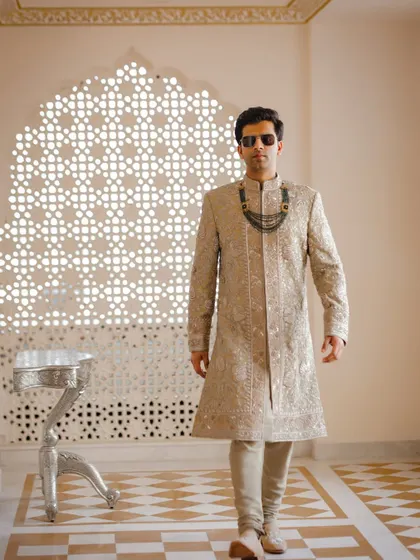 A stylish groom portrait at the Anantara Jaipur, showcasing a modern royal look.