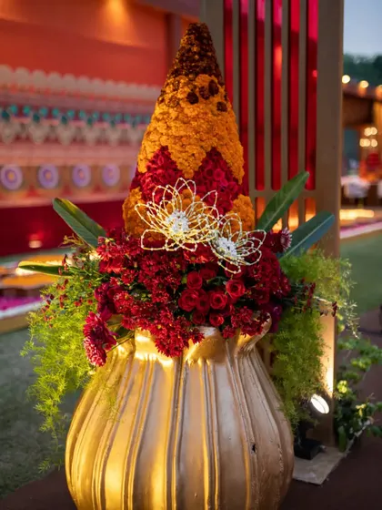 A close-up of the floral 'Kalash', highlighting the detailed craftsmanship and the addition of a delicate, wired jasmine lotus flower.