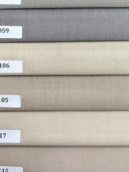 A selection of neutral shades, from light grey to beige. These versatile colors are perfect for creating foundational pieces like trousers and blazers.