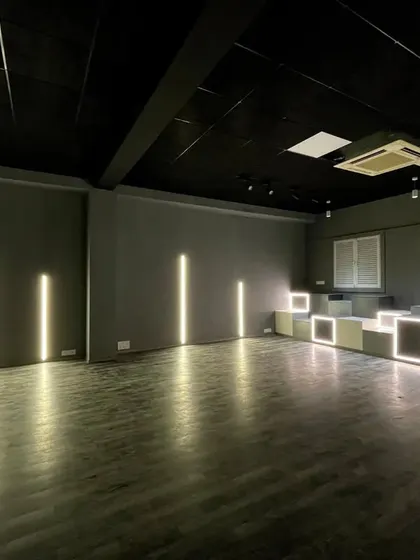 Another angle of our versatile studio space, showcasing the seating area and dynamic lighting options that create the perfect mood for any dance style.