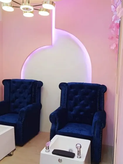 Our comfortable and stylish pedicure chairs at the Koramangala branch, set against a beautifully designed accent wall.