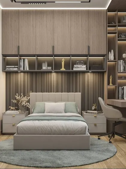 This compact bedroom is designed for a student, with a wardrobe and bookshelf built around the bed to maximize storage. The integrated desk by the window offers a bright spot for studying.