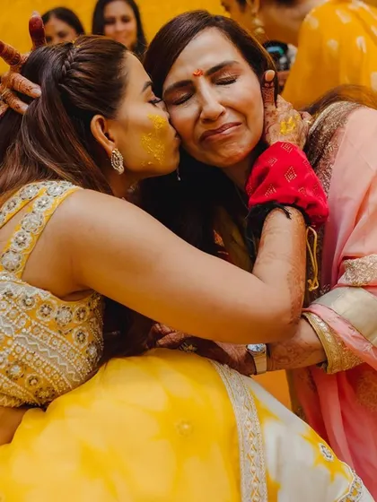 A beautiful, emotional moment between the bride and her mother during the Haldi ceremony. These are the precious memories that make all the planning worthwhile.