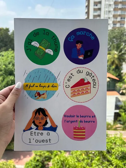 A sheet of our custom-designed French idiom stickers. These fun visuals help students remember common expressions like "c'est du gâteau" (it's a piece of cake).