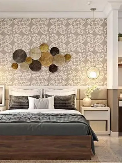 This bedroom includes a compact study corner with open shelving, demonstrating how to integrate a workspace without compromising style.