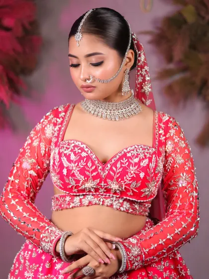 A moment of quiet elegance. The soft lighting highlights the flawless base and the intricate details of the bridal jewelry.
