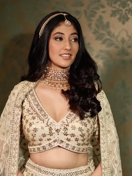 A modern bridal look for the contemporary bride. The makeup is neutral and glowing, allowing her natural beauty and stunning Anita Dongre outfit to shine.
