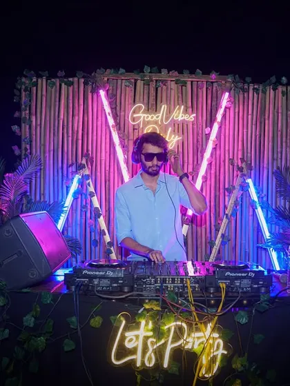 Good vibes only. A shot of my setup at Bombay Adda, with a cool neon backdrop perfect for a party night.