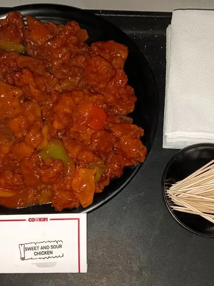 A serving of our popular sweet and sour chicken. This dish is a perfect example of the delicious Indo-Chinese cuisine we offer.