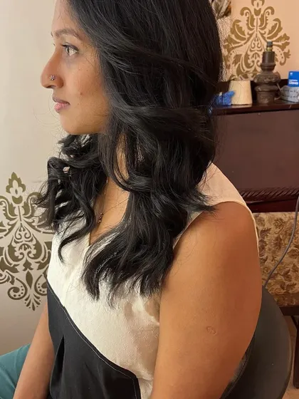 A side view of the soft, face-framing layers.
