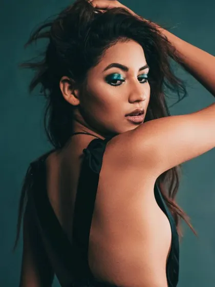 An editorial shot from a lighting workshop, where I styled influencer Shivani Singh. The focus was on creating a dramatic look with a simple black dress, using hair movement and makeup to capture the light.