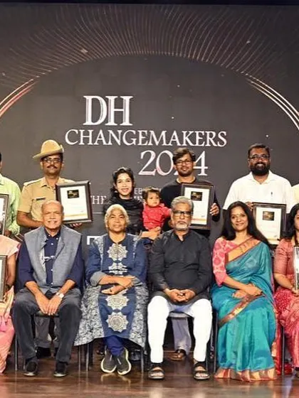The full group of jury members and changemakers on one stage. This image represents a powerful gathering of individuals committed to making a difference in Karnataka.