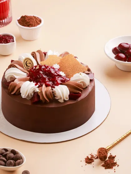 The full view of our seasonal Black Forest Cake, made with fresh cherries, rich chocolate ganache, and velvety vanilla bean cream.