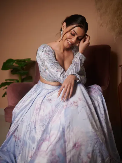 A happy, candid moment from the shoot. This shows the softer side of the glam look, perfect for any special occasion.