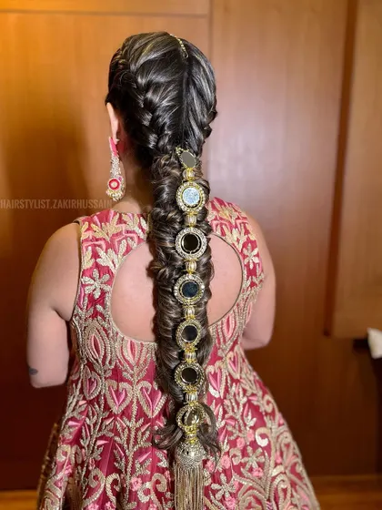 Another angle of the mirror-work braid, showing the intricate details of the accessories and the neatness of the braid.