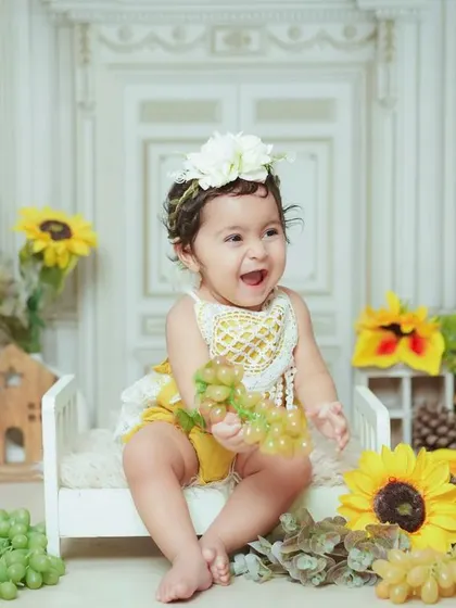 A burst of laughter in our sunflower-themed setup. We love capturing these genuinely happy moments.