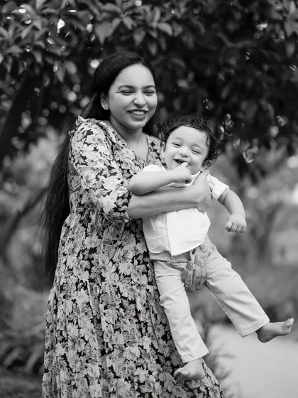 A mother's love and a child's hearty laugh, captured in a timeless black and white portrait. These are the honest, joyful moments that I live to photograph, creating memories that will be carried forever.