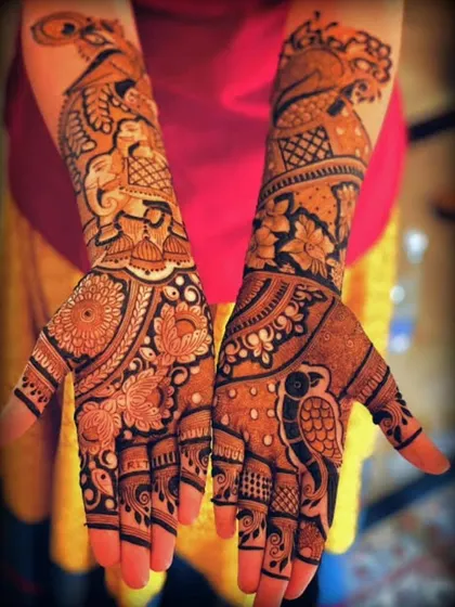A vibrant design filled with peacocks, elephants, and floral motifs, perfect for a grand celebration.