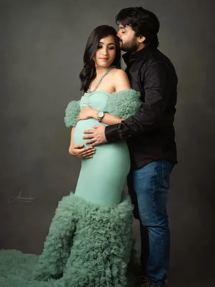 A sweet kiss from the dad-to-be. This pose is a beautiful way to show the love and support surrounding the mom-to-be during her pregnancy.