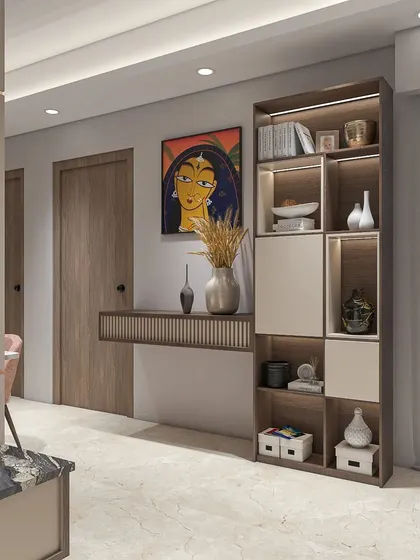 A beautiful console and shelving unit designed for an entryway or living space. The combination of wood, light-colored laminates, and a striking piece of Indian art creates a welcoming and culturally rich vignette.