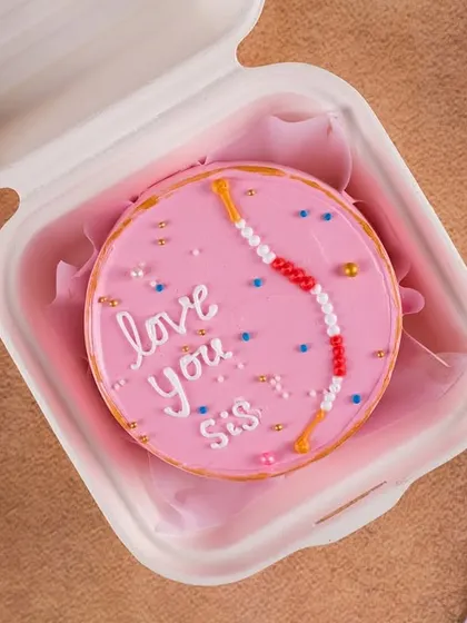 And for the sister, an "I love you Sis" Rakhi-themed bento cake. These matching sibling bentos are perfect for making Raksha Bandhan memorable.