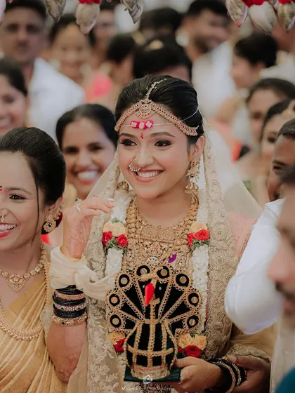 A beautiful candid shot of a bride, Yashaswini, during her wedding ceremony. I had the pleasure of creating her traditional bridal hairstyle for her special day.