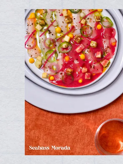 The vibrant Seabass Morada. This crudo dish is a visual and culinary delight, featuring thinly sliced seabass with a colourful, tangy dressing that awakens the palate.