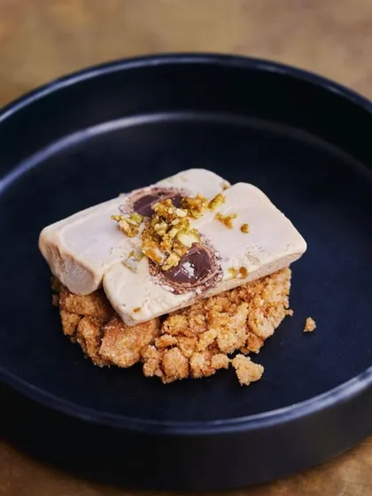 Our bestselling Salted Chikki Kulfi, featuring a Monaco biscuit crumble and chocolate Ferrero Rocher.