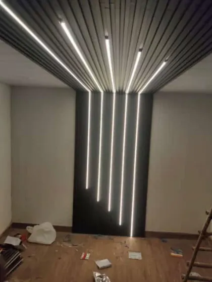 A stunning example of what's possible with louver panels and lighting. I created a cascading light effect on this wall and ceiling, making it a true architectural feature.