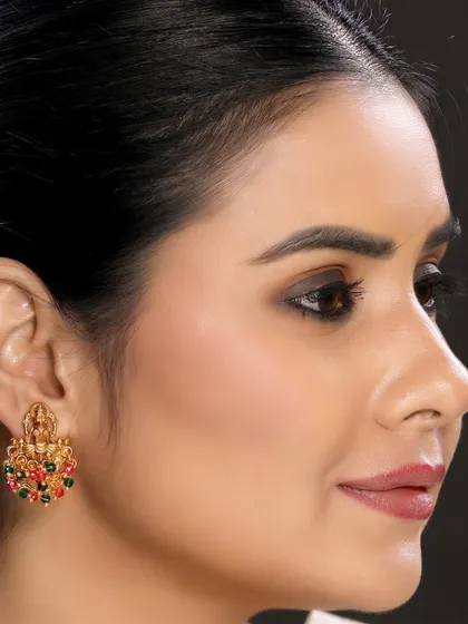 A close-up of a stud-style earring with multi-colored stones, demonstrating our versatility in shooting different types of ethnic jewellery.