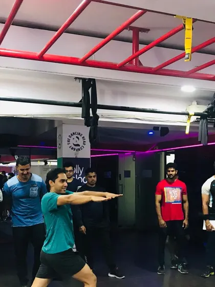 Learning by doing is a core part of our philosophy. Here, a student demonstrates a movement while the group observes and analyzes the biomechanics involved.
