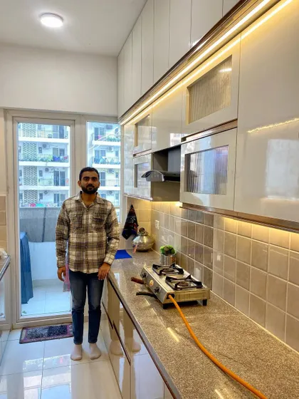 Me standing in the completed kitchen. It's always a proud moment to see the final result of our hard work.