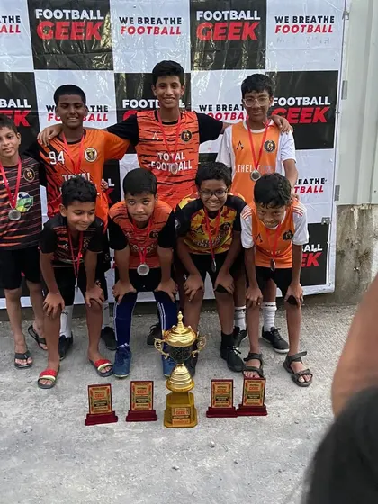 The U13 team celebrating their championship win at the Independence Cup.