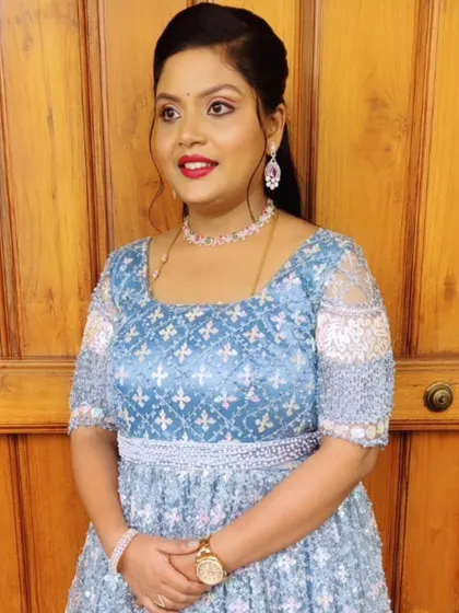 Another angle of this beautiful reception look, showing how the makeup and simple hairstyle complement the detailed beadwork on the gown.