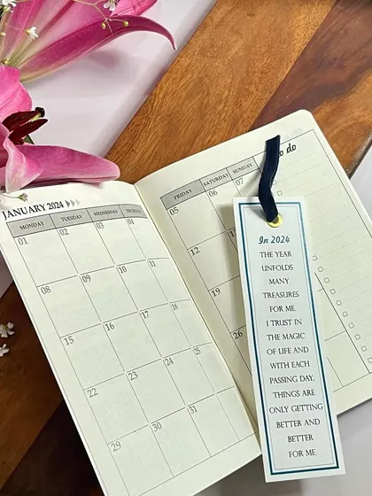 An inside look at our 2024 pocket planner, showing the monthly view and a to-do list. It's the perfect companion for on-the-go planning.