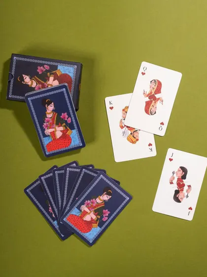 A styled shot of Namostutay playing cards, arranged neatly on a solid green background. This clean composition is perfect for catalog and website use.