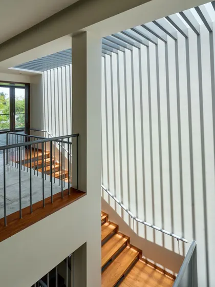 Photography is just light remembering itself. I use architectural elements like these fins to cast stellar patterns of light and shadow, turning a simple staircase into a dynamic experience that changes throughout the day.