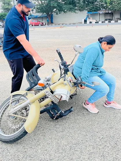 A demonstration of how to safely lift a fallen motorcycle. This practical skill empowers our students and removes a common fear for new riders.