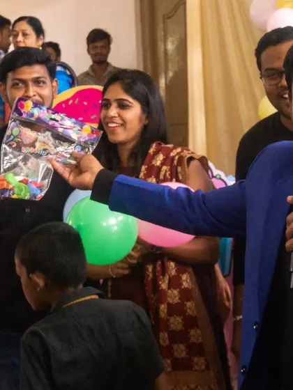 Handing out props for an interactive group game. I come prepared with all the necessary items to conduct fun and engaging activities for your guests.