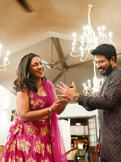 The couple shares a dance during their intimate engagement party, surrounded by elegant decor.